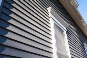 gray siding and white window