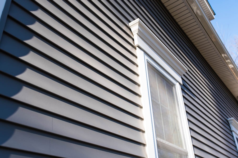 siding-damage-repair-little-canada-mn gray siding and white window