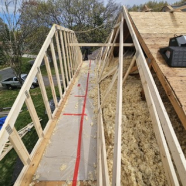 New framing and structural repair underway after roof-truss damage