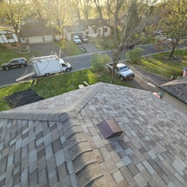 Repaired roof decking and shingles during structural restoration