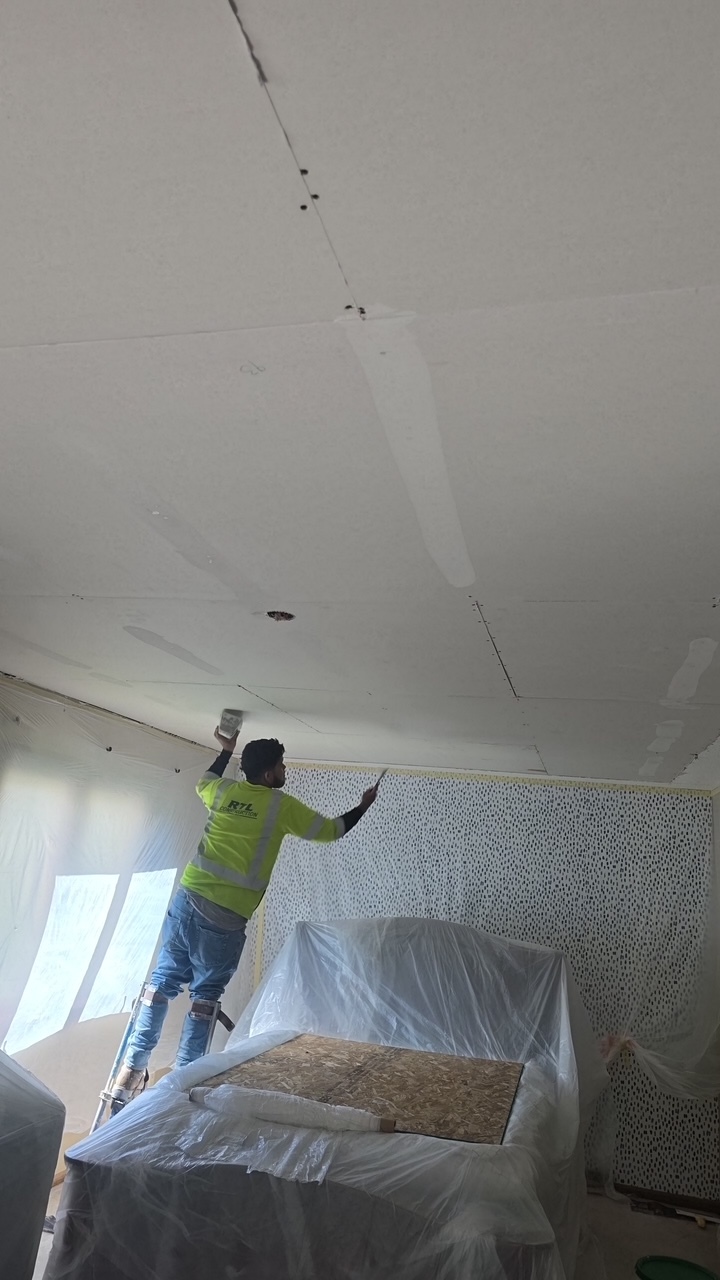 Interior ceiling repair beneath the primary bedroom after tree damage
