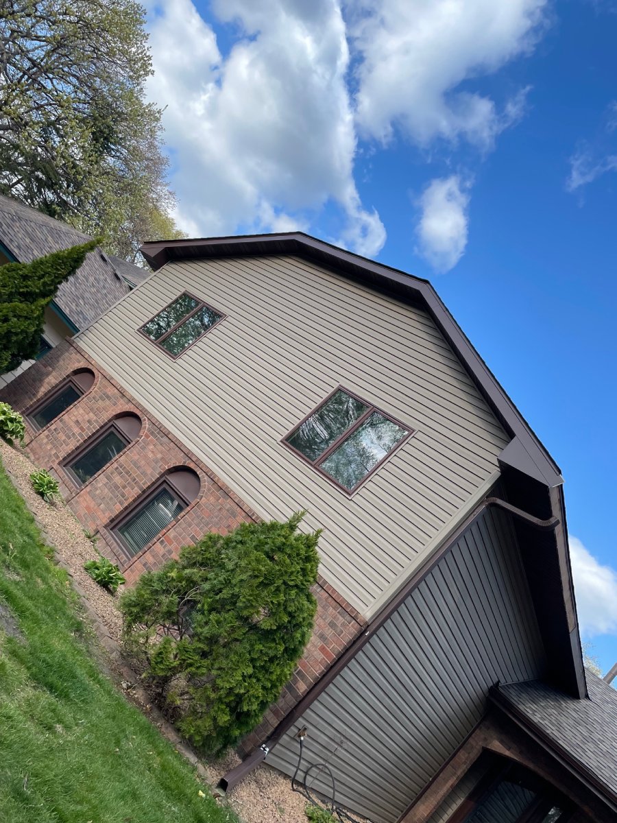 Restored roofline and gable of the Blaine home after repairs