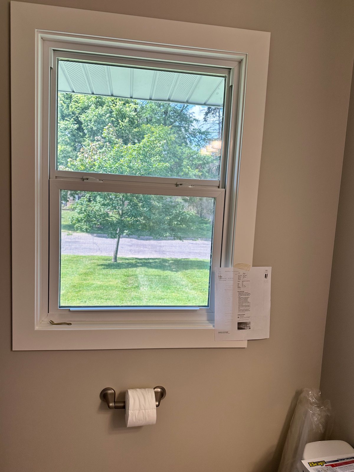 Interior window looking out to green lawn
